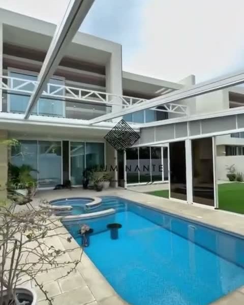 Retractable fabric roof pergola, 9 m wide × 12 m projection, with sliding glass
