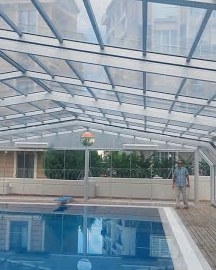 Telescopic sliding pool roof